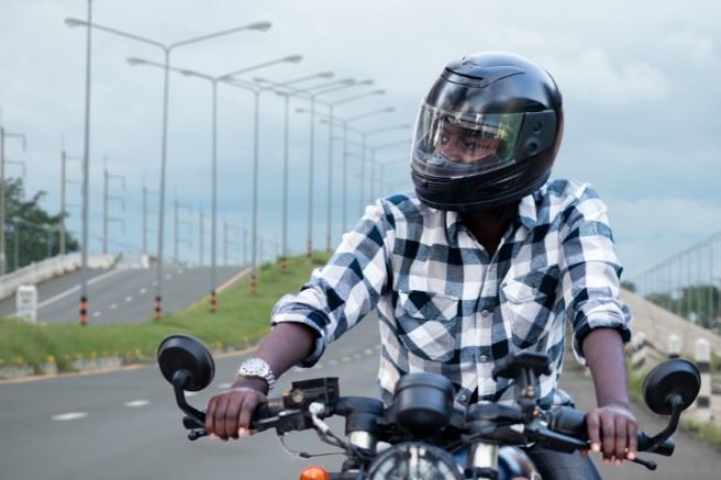 Man Riding A Motorcycle On The Freeway