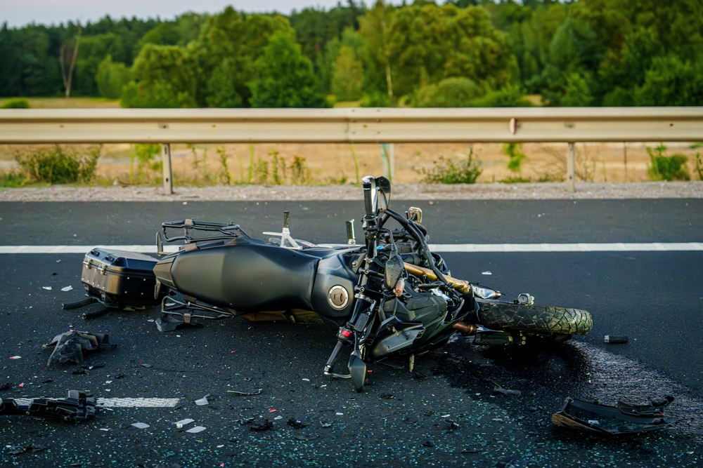 A damaged motorcycle lying on a highway after a serious crash near Reno, Nevada.